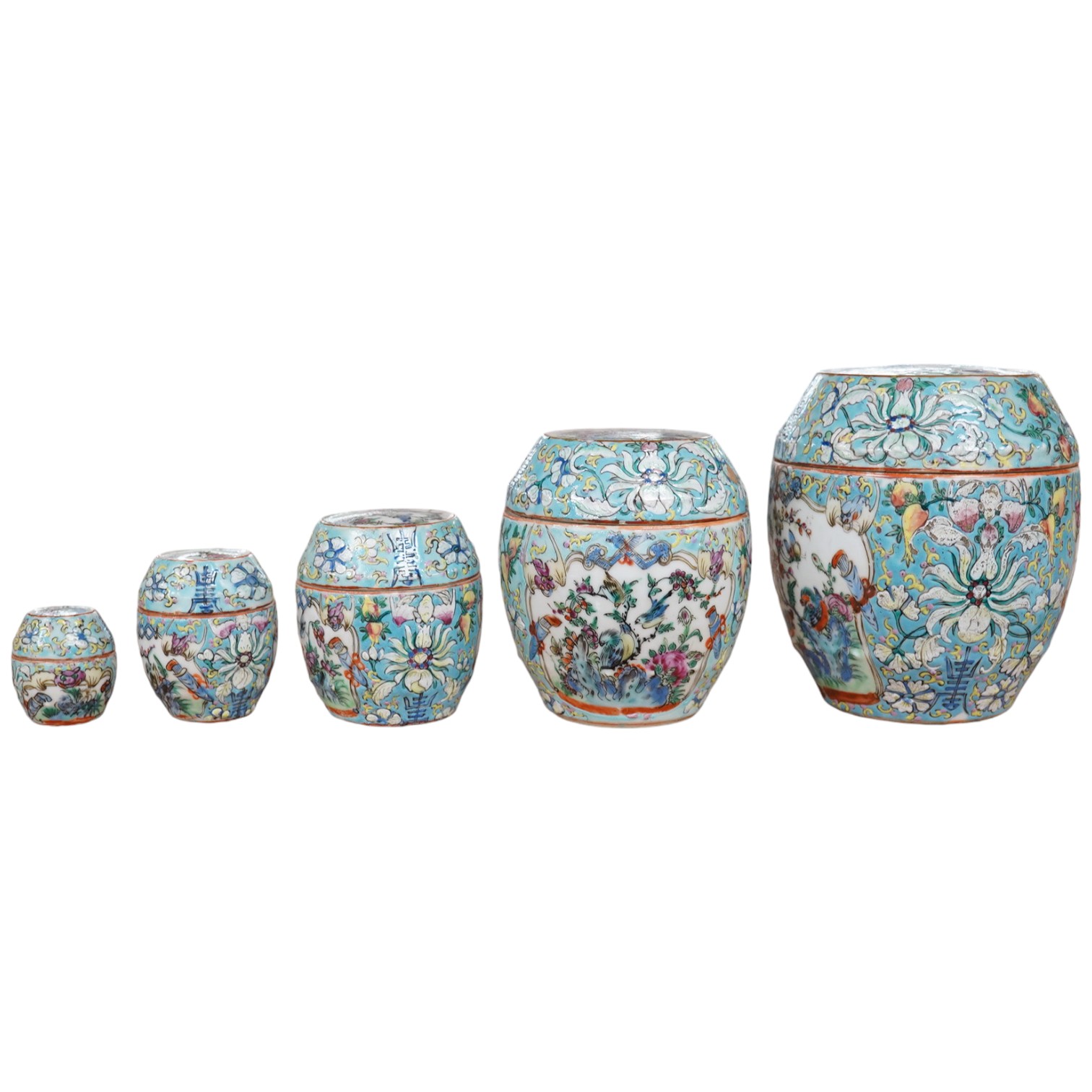 A complete Chinese porcelain nest of five enamelled porcelain barrel shaped boxes, c.1900, largest 12cm high. Condition - fair, some minor chipping